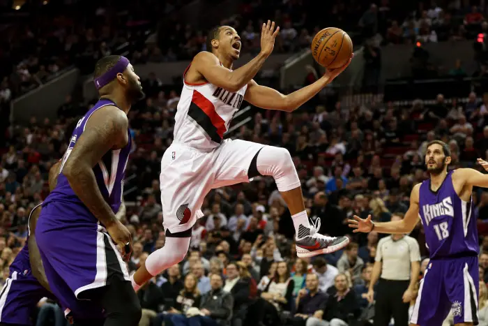 CJ MCCOLLUM (3) drives to the hoop.