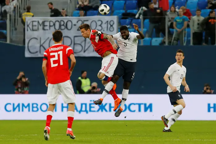 Soccer Football - International Friendly - Russia vs France - Saint-Petersburg Stadium, Saint Petersburg, Russia - March 27, 2018   France¹s Samuel Umtiti in action with Russia¹s Fedor Smolov