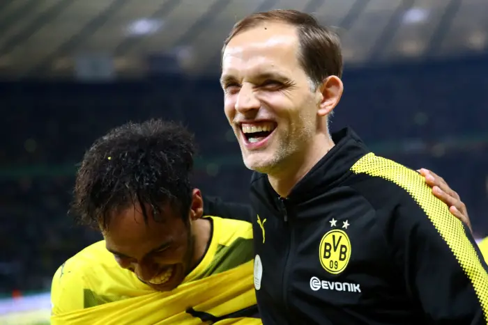 Football Soccer - Eintracht Frankfurt v Borussia Dortmund - DFB-Pokal Final - Olympic Stadium, Berlin, Germany - 27/5/17 Borussia Dortmund coach Thomas Tuchel celebrates with Pierre-Emerick Aubameyang after victory Reuters / Michael Dalder Livepic DFL RULES TO LIMIT THE ONLINE USAGE DURING MATCH TIME TO 15 PICTURES PER GAME. IMAGE SEQUENCES TO SIMULATE VIDEO IS NOT ALLOWED AT ANY TIME. FOR FURTHER QUERIES PLEASE CONTACT DFL DIRECTLY AT + 49 69 650050      DFB RULES PROHIBIT USE IN MMS SERVICES VIA HANDHELD DEVICES UNTIL TWO HOURS AFTER A MATCH AND ANY USAGE ON INTERNET OR ONLINE MEDIA SIMULATING VIDEO FOOTAGE DURING THE MATCH.