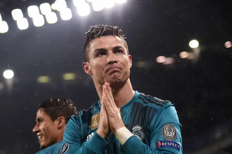 Real Madrid's Portuguese forward Cristiano Ronaldo celebrates after scoring a second goal during the UEFA Champions League quarter-final first leg football match between Juventus and Real Madrid at the Allianz Stadium in Turin on April 3, 2018. / AFP PHOTO / Marco BERTORELLO