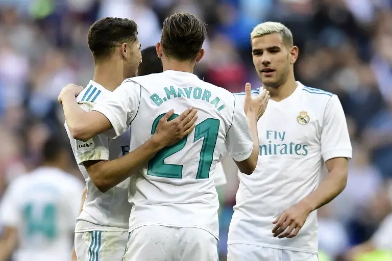 Real Madrid's Spanish forward Borja Mayoral (C) celebrates with teammates after scoring a goal during the Spanish League football match between Real Madrid and Leganes at the Santiago Bernabeu Stadium in Madrid on April 28, 2018. / AFP PHOTO / JAVIER SORIANO