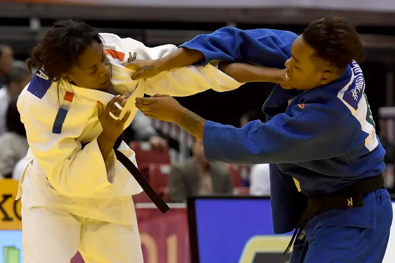 Audrey Tcheumeo of France (R) fights with compatriot Madeleine Malonga during their women's under 78kg category bronze medal final match of the Judo Grand Slam Tokyo 2017 in Tokyo on December 3, 2017.   / AFP PHOTO / Toshifumi KITAMURA