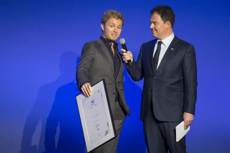 GermanFinnish former Formula One racing driver, Nico Rosberg (L) speaks after being inducted into the FIA Hall of Fame, during a ceremony on December 4, 2017 at the Automobile Club of France (ACF) in Paris.  / AFP PHOTO / CHRISTOPHE ARCHAMBAULT