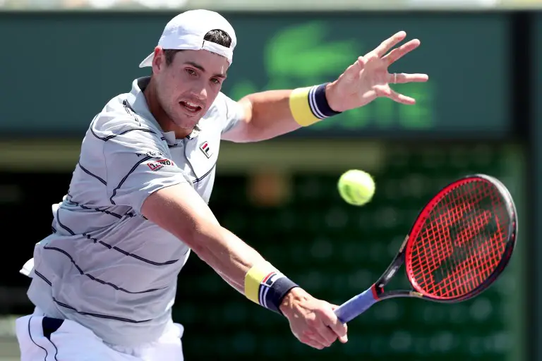 KEY BISCAYNE, FL - APRIL 01: John Isner returns a shot to Alexander Zverev of German during the men's final of the Miami Open Presented by Itau at Crandon Park Tennis Center on April 1, 2018 in Key Biscayne, Florida.   Matthew Stockman/Getty Images/AFP