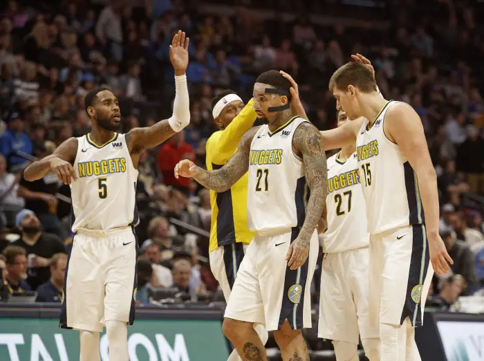 April 3, 2018 - Denver, Colorado, U.S - Nuggets WILL CHANDLER, center, gets congrats from team mates as they head to a time out during the 1st. Half at the Pepsi Center Tuesday Night. The Nuggets beat the Pacers 107-104.
