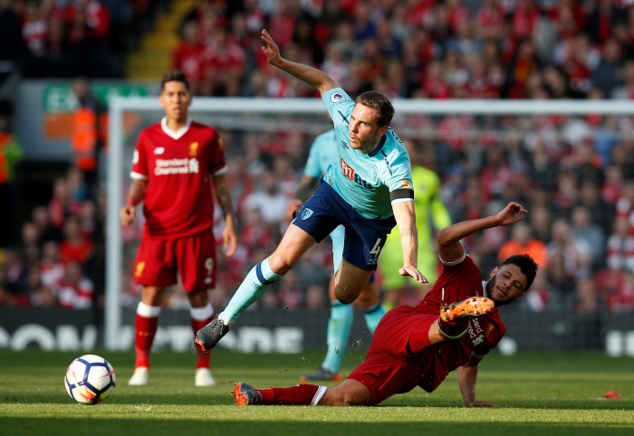 Soccer Football - Premier League - Liverpool vs AFC Bournemouth - Anfield, Liverpool, Britain - April 14, 2018   Bournemouth's Dan Gosling in action with Liverpool's Alex Oxlade-Chamberlain
