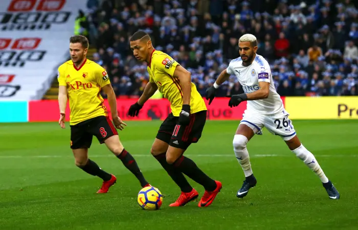 Richarlison of Watford wins the ball against Riyad Mahrez of Leicester City during the Premier League match between Watford and Leicester City at Vicarage Road on December 26th 2017 in Watford, England.