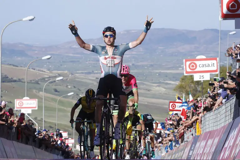 Belgium's rider of team Lotto Tim Wellens celebrates as he crosses the finish line and won the 4th stage of the 101st Giro d'Italia, Tour of Italy cycling race, between Catania and Caltagirone (Sicily), on May 8, 2017.  / AFP PHOTO / Luk Benies