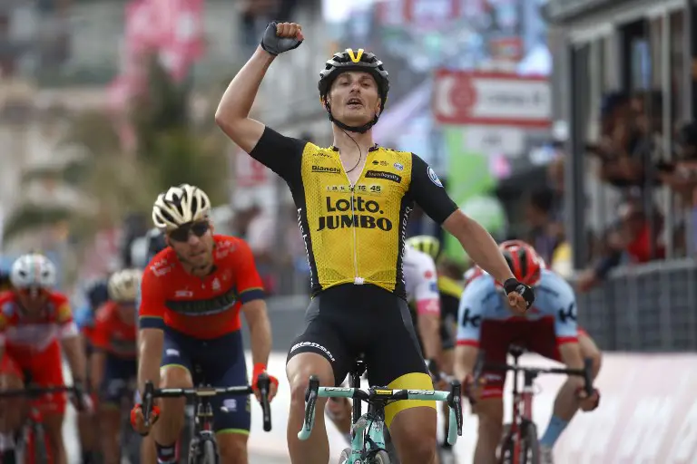 Italy's rider of team Lotto-Jumbo Enrico Battaglin celebrates as he crosses the finish line to win the 5th stage between Agrigento (Sicily) and Santa Ninfa during the 101st Giro d'Italia, Tour of Italy cycling race, on May 9, 2018. 
Battaglin dominated a sprint finish with compatriot Giovanni Visconti and Portugal's Jose Goncalves, who finished second and third respectively. / AFP PHOTO / LUK BENIES