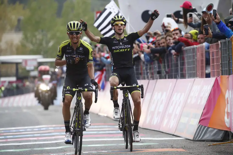 Colombia's rider of team Mitchelton-Scott Johan Esteban Chaves (L) crosses the finish line ahead of teammate Britain's rider of team Mitchelton-Scott Simon Yates to win the 6th stage between Caltanissetta (Sicily) and the Mount Etna during the 101st Giro d'Italia, Tour of Italy cycling race, on May 10, 2018. 
Chaves, taking his second Giro stage win, finished just ahead of British teammate Simon Yates, whose late surge to join Chaves in the final kilometre earned him the overall leader's pink jersey. FDJ's Thibaut Pinot finished third, some 30 seconds behind the leading pair, after a 164km ride between Caltanissetta and Etna, with Froome finishing seconds behind the Frenchman.
 / AFP PHOTO / LUK BENIES