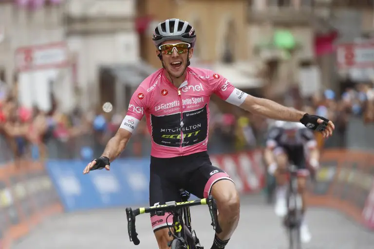 Britain's rider of team Mitchelton-Scott Simon Yates celebrates after winning the 11th stage between Assisi and Osimo during the 101st Giro d'Italia, Tour of Italy cycling race, on May 16, 2018.  / AFP PHOTO / Luk Benies