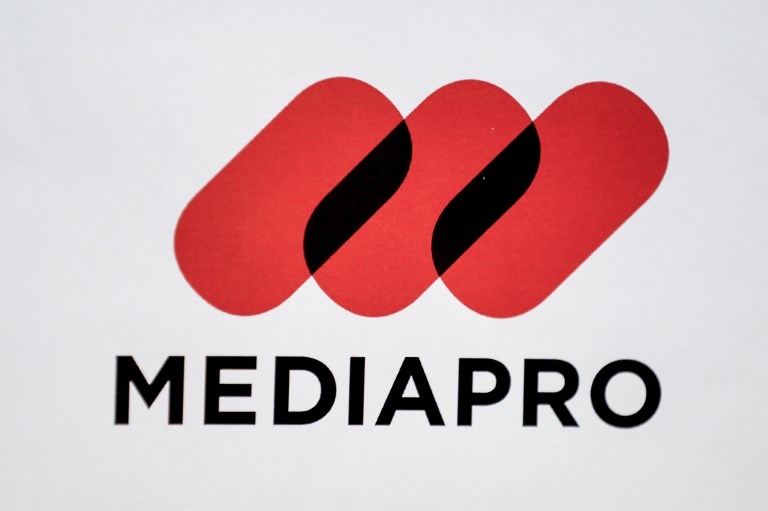 Spain's Barcelona-based production company Mediapro logo is pictured during a press conference on May 31, 2018 in Paris, two days after the group won the rights to broadcast the games for the period 2020 to 2024 in an auction by the French football league.
Spain's Mediapro, majority-owned by a Chinese investment fund, has strengthened its presence in European sports broadcasting by snapping up the rights to broadcast France's Ligue 1 football, highlighting the growing interest in China for European football. / AFP PHOTO / FRANCOIS GUILLOT