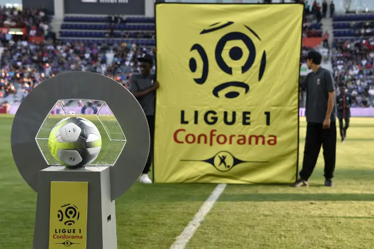The new sponsor logo "Ligue 1 - Conforama" is installed next to the new official ball, prior to the French Ligue 1 football match between Toulouse and Montpellier at the Municipal Stadium in Toulouse, southern France, on August 12, 2017.  / AFP PHOTO / PASCAL PAVANI