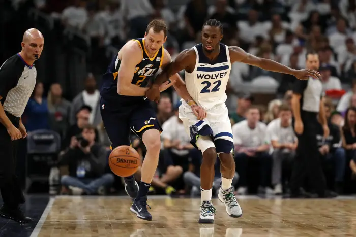 October 20, 2017 - Minneapolis, MN, USA - Minnesota Timberwolves guard Andrew Wiggins (22) chases down Utah Jazz forward Joe Ingles (2) for a loose ball in the first half on Friday, Oct. 20, 2017, at the Target Center in Minneapolis.