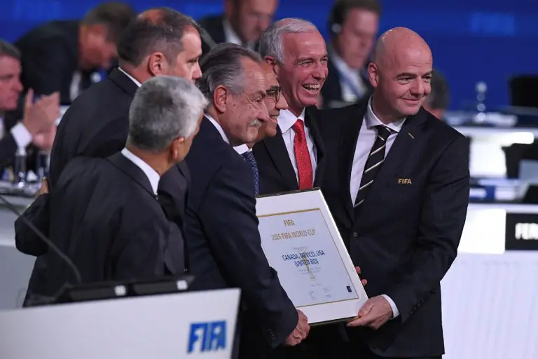 FIFA president Gianni Infantino (R) poses with the United 2026 bid (Canada-Mexico-US) officials Carlos Cordeiro (3rd R), president of the United States Football Association, president of the Mexican Football Association Decio de Maria Serrano (3rd L), Steve Reed (2nd R), president of the Canadian Soccer Association, following the announcement of the 2026 World Cup host during the 68th FIFA Congress at the Expocentre in Moscow on June 13, 2018. / AFP PHOTO / Kirill KUDRYAVTSEV