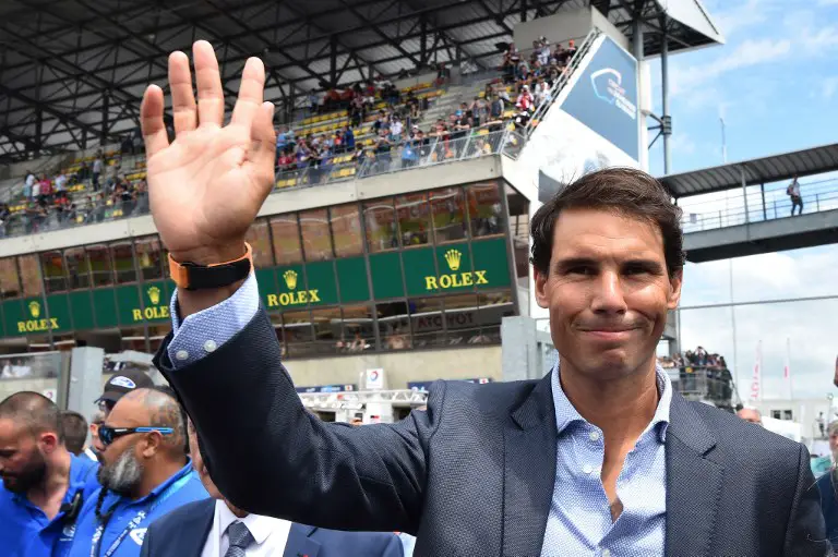Spanish tennis player Rafael Nadal gestures before he waves the starters flag for the 86th edition of the 24-Hour endurance race on June 16, 2018, at the Le Mans circuit. / AFP PHOTO / JEAN-FRANCOIS MONIER