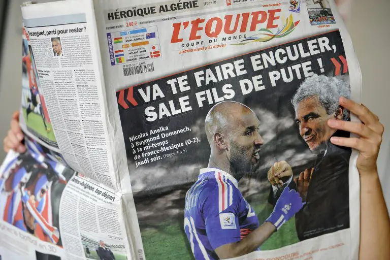 A person reads French sport newspaper L'Equipe on June 19, 2010 in Strasbourg. France striker Nicolas Anelka was kicked out of the World Cup on Saturday after reportedly launching a tirade of abuse at coach Raymond Domenech, according the French Football Federation (FFF). The 31-year-old Chelsea forward is reported to have told Domenech to "go screw yourself, dirty son of a whore" in the dressing room after the coach took issue with his first-half performance against Mexico, sports daily L'Equipe claimed. AFP PHOTO / JOHANNA LEGUERRE / AFP PHOTO / JOHANNA LEGUERRE