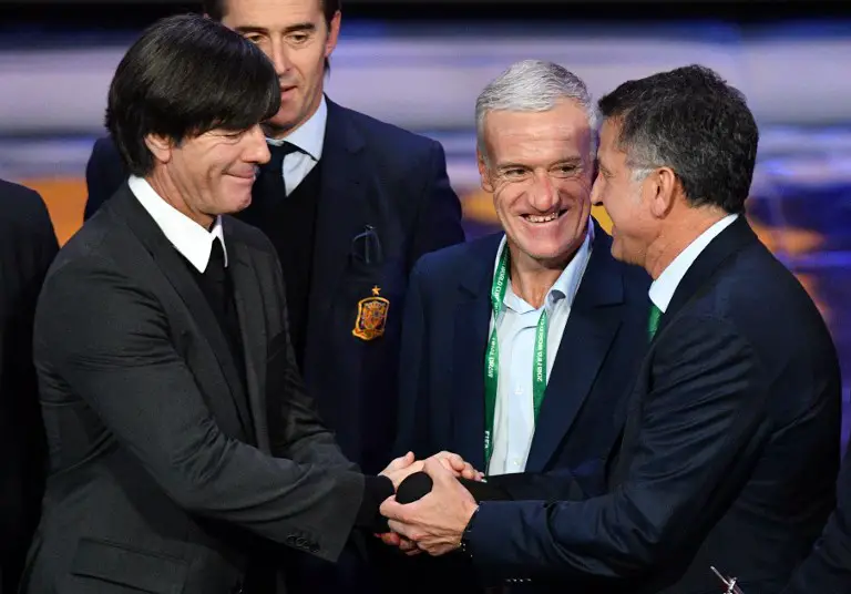 Germany's national football team coach Joachim Loew (L), France's national football team coach Didier Deschamps and Mexico's national football team coach Juan Carlos Osorio (R) speak at the end of the Final Draw for the 2018 FIFA World Cup football tournament at the State Kremlin Palace in Moscow on December 1, 2017.
The 2018 FIFA World Cup will be held from June 14 and July 15, 2018, in 11 Russian cities. / AFP PHOTO / Mladen ANTONOV