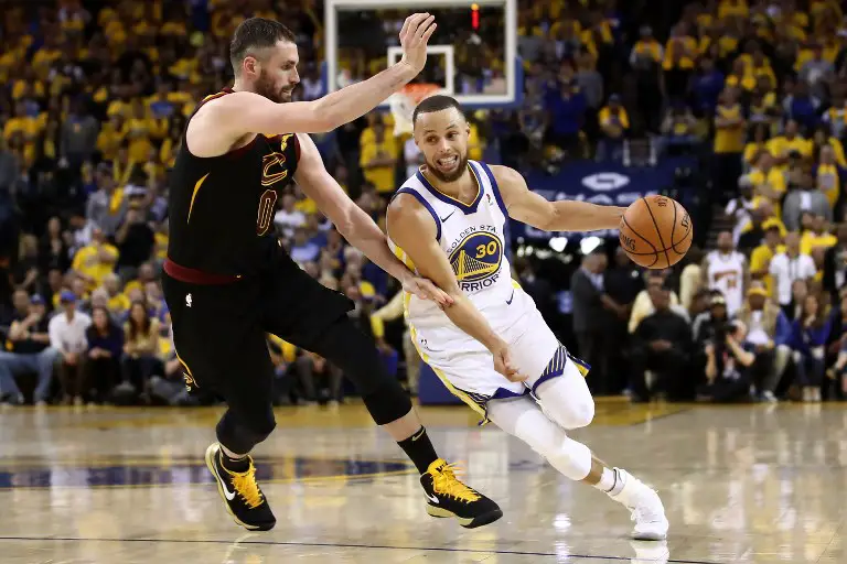 OAKLAND, CA - MAY 31: Stephen Curry #30 of the Golden State Warriors drives to the basket defended by Kevin Love #0 of the Cleveland Cavaliers in Game 1 of the 2018 NBA Finals at ORACLE Arena on May 31, 2018 in Oakland, California. NOTE TO USER: User expressly acknowledges and agrees that, by downloading and or using this photograph, User is consenting to the terms and conditions of the Getty Images License Agreement.   Ezra Shaw/Getty Images/AFP