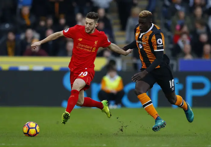 Liverpool's Adam Lallana in action with Hull City's Alfred N'Diaye