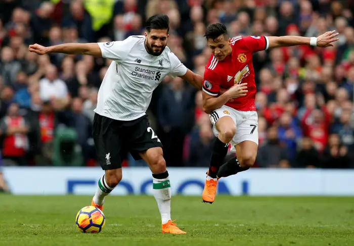 Liverpool's Emre Can in action with Manchester UnitedÄôs Alexis Sanchez