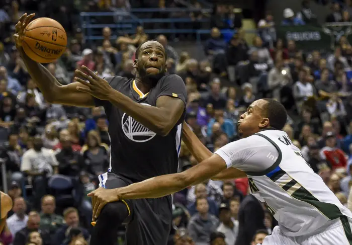 Golden State Warriors forward Draymond Green (23) drives to the basket against Milwaukee Bucks forward John Henson (31) in the second quarterat BMO Harris Bradley Center.