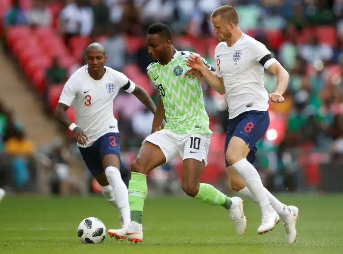 England's Ashley Young and Eric Dier in action with NigeriaÄôs John Obi Mikel