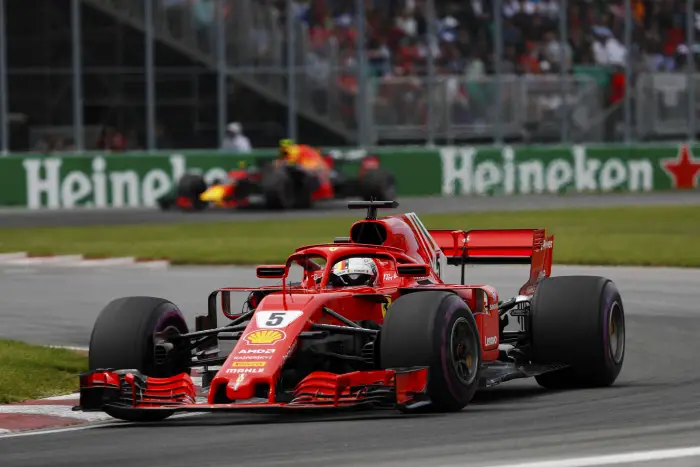 CIRCUIT GILLES-VILLENEUVE, CANADA - JUNE 10: Sebastian Vettel, Ferrari SF71H, leads Max Verstappen, Red Bull Racing RB14 Tag Heuer during the Canadian GP at Circuit Gilles-Villeneuve on June 10, 2018 in Circuit Gilles-Villeneuve, Canada.