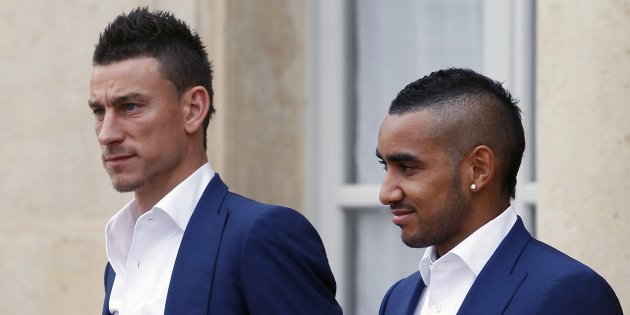 PARIS, FRANCE - JULY 11:  France's national soccer team players Laurent Koscielny (L) and Dimitri Payet leave after a lunch with French President Francois Hollande at the Elysee Palace on July 11, 2016 in Paris, France. France. Portugal's national football team beat the national team of France in the final of Euro 2016 yesterday.  (Photo by Chesnot/Getty Images)