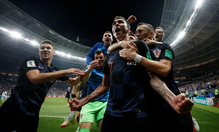 Soccer Football - World Cup - Semi Final - Croatia v England - Luzhniki Stadium, Moscow, Russia - July 11, 2018  Croatia's Mario Mandzukic celebrates scoring their second goal with teammates