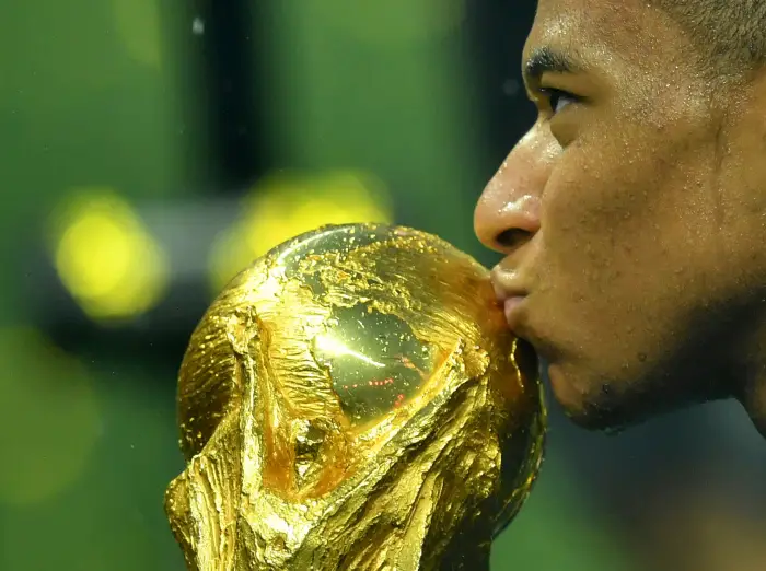 Soccer Football - World Cup - Final - France v Croatia - Luzhniki Stadium, Moscow, Russia - July 15, 2018  France's Kylian Mbappe kisses the trophy as he celebrates winning the World Cup