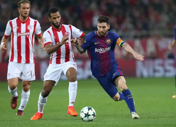 Soccer Football - Champions League - Olympiacos vs FC Barcelona - Karaiskakis Stadium, Piraeus, Greece - October 31, 2017   BarcelonaÄôs Lionel Messi in action with Olympiacos' Alaixys Romao