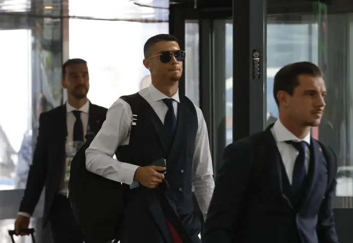 Soccer Football - World Cup - Portugal Departure - Zhukovsky International Airport, Moscow Region, Russia - July 1, 2018. Cristiano Ronaldo and other team members use an escalator before the departure.