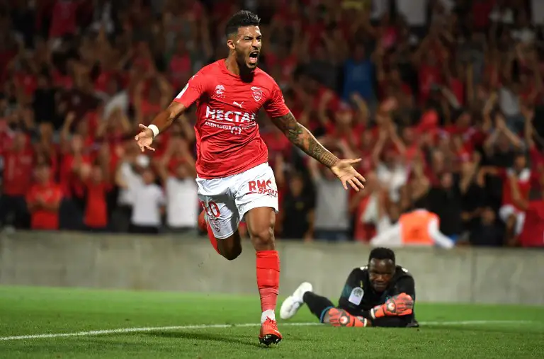 Nîmes' French midfielder Denis Bouanga celebrates after scoring during the French L1 football match Nîmes vs Marseille, at the the Costières stadium in Nîmes, southern France on August 19, 2018. / AFP PHOTO / PASCAL GUYOT