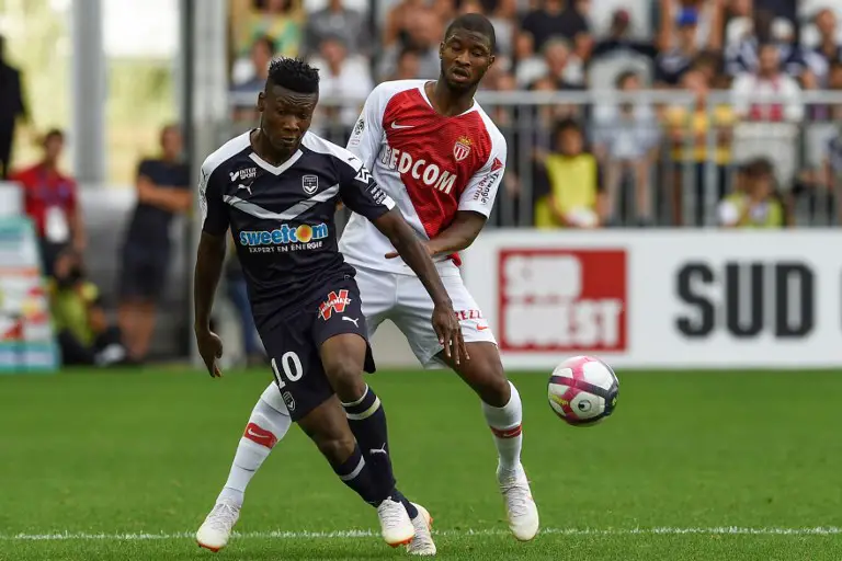 Monaco's Malian midfielder Adama Traore (R) vies with Bordeaux's Nigerian forward Samuel Kalu during the French L1 football match between Bordeaux and Monaco on August 26, 2018 at the Matmut Atlantique stadium in Bordeaux, southwestern France. / AFP PHOTO / NICOLAS TUCAT