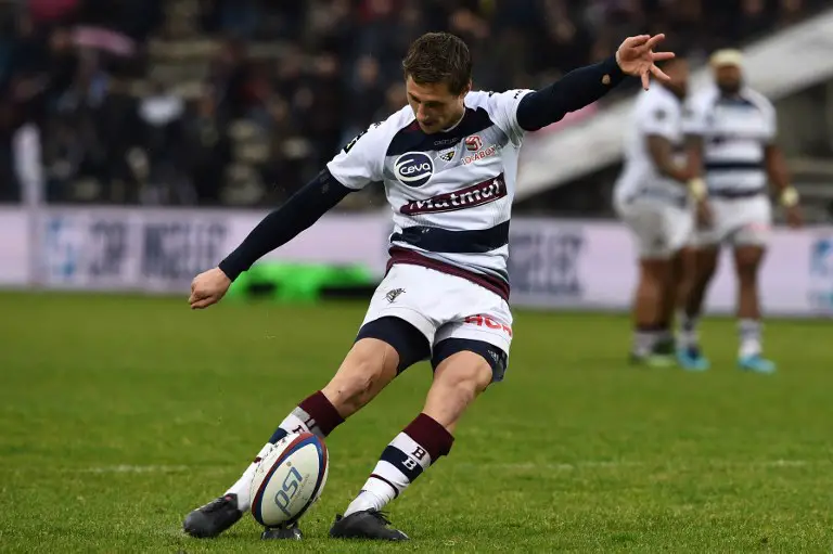 Bordeaux-Begles' French scrumhalf Baptiste Serin kicks the ball during the French Top 14 rugby union match between Bordeaux-Begles and Pau on April 7, 2018 at the Chaban-Delmas stadium in Bordeaux, southwestern France.  / AFP PHOTO / NICOLAS TUCAT