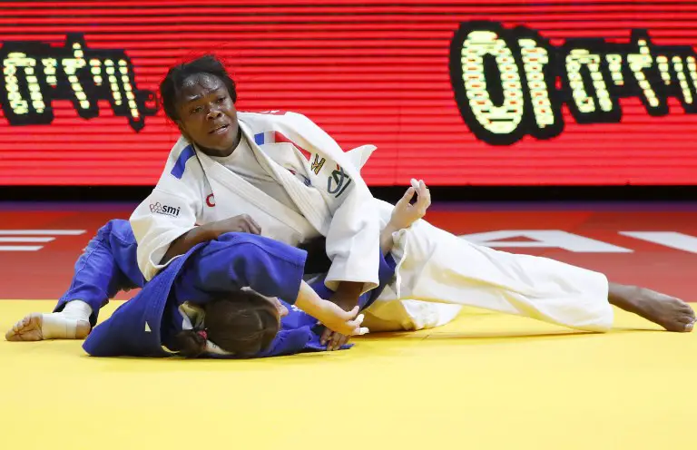French's Clarisse Agbegnenou (white) competes against Slovenia's Tina Trstenjak during their women's under 63 kilograms weight category final match of the European Judo Championship in the Israeli coastal city of Tel Aviv on April 27, 2018. / AFP PHOTO / JACK GUEZ