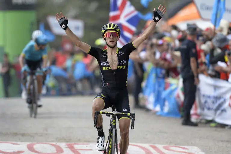 MitcheltonScott's British cyclist Simon Yates celebrates as he wins the 14th stage of the 73rd edition of "La Vuelta" Tour of Spain cycling race, a 171-km route from Cistierna to Les Praeres next to Nava on September 8, 2018. / AFP PHOTO / MIGUEL RIOPA