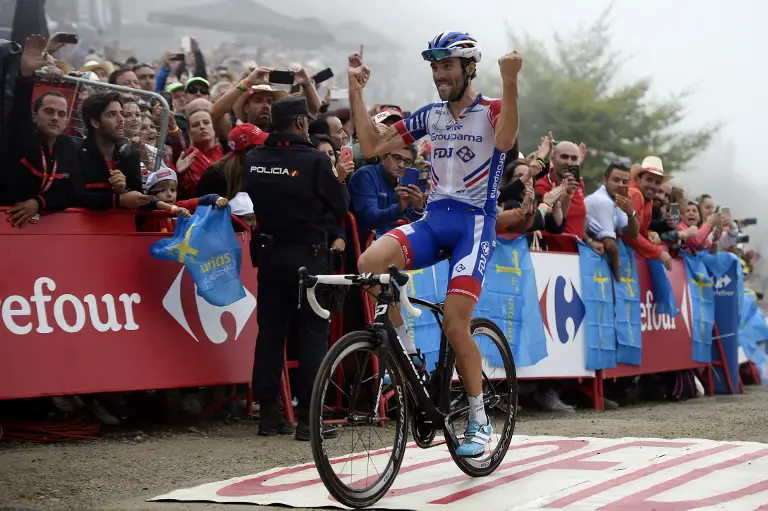 Groupama-FDJ's French cyclist Thibaut Pinot celebrates after winning the 15th stage of the 73rd edition of "La Vuelta" Tour of Spain cycling race, a 178.2 km route from Ribera de Arriba to Lakes of Covadonga near Cangas de Onis on September 9, 2018. / AFP PHOTO / Miguel RIOPA