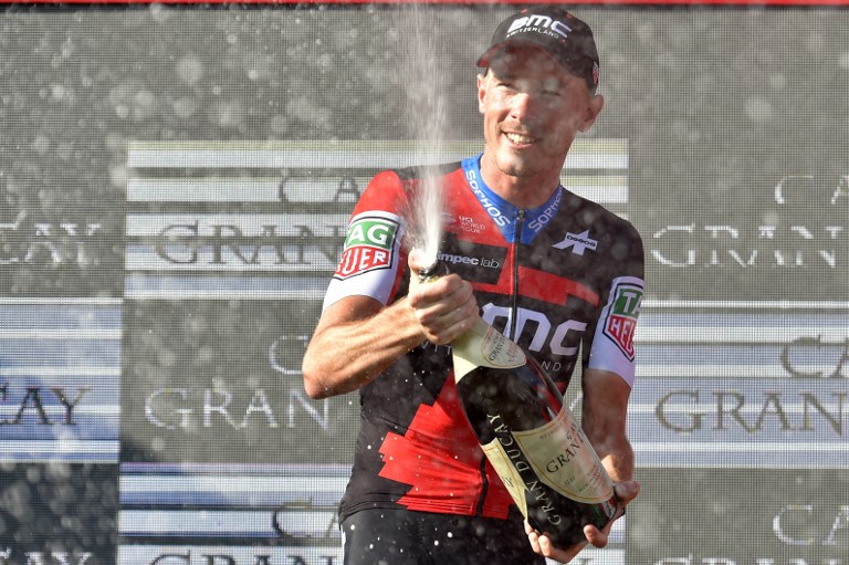 BMC Racing Team's Australian cyclist Rohan Dennis celebrates after winning the 16th stage of the 73rd edition of "La Vuelta" Tour of Spain cycling race, a 32 km individual time-trial from Santillana del Mar to Torrelavega, on September 11, 2018.  / AFP PHOTO / ANDER GILLENEA