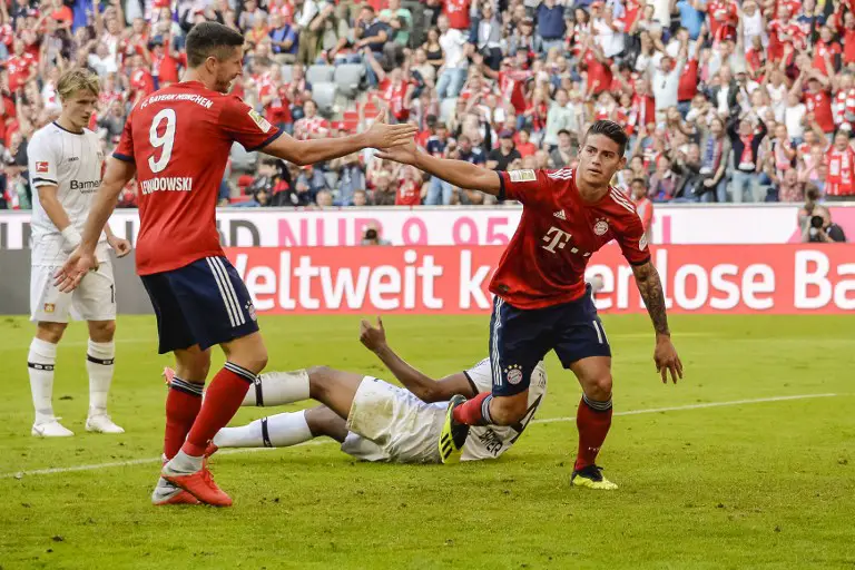 Bayern Munich's Columbian midfielder James Rodriguez (R) celebrates his goal  during the German First division Bundesliga football match between FC Bayern Munich and Bayer Leverkusen in Munich, on September 15, 2018. / AFP PHOTO / Guenter SCHIFFMANN / DFL REGULATIONS PROHIBIT ANY USE OF PHOTOGRAPHS AS IMAGE SEQUENCES AND/OR QUASI-VIDEO