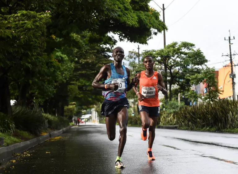 Kenyan athletes Joseph Kiprono (L) and Daniel Muindi run the 21km race at the Medellin Flowers Marathon, in the Colombian city of Medellin on September 16, 2018.
Kiprono was hit by a car as he was leading the race 1.5km prior to the finish line and was taken to hospital while Muindi won the race with a time of 1:03:45. More than 15,000 runners took part in four different running events.  / AFP PHOTO / Joaquin SARMIENTO