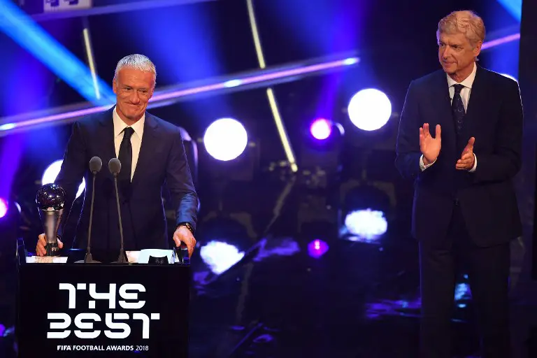 Former Arsenal manager Arsene Wenger (R) applauds as France's coach Didier Deschamps smiles after winning the trophy for the Best FIFA Men's Coach of 2018 Award during The Best FIFA Football Awards ceremony, on September 24, 2018 in London. / AFP PHOTO / Ben STANSALL