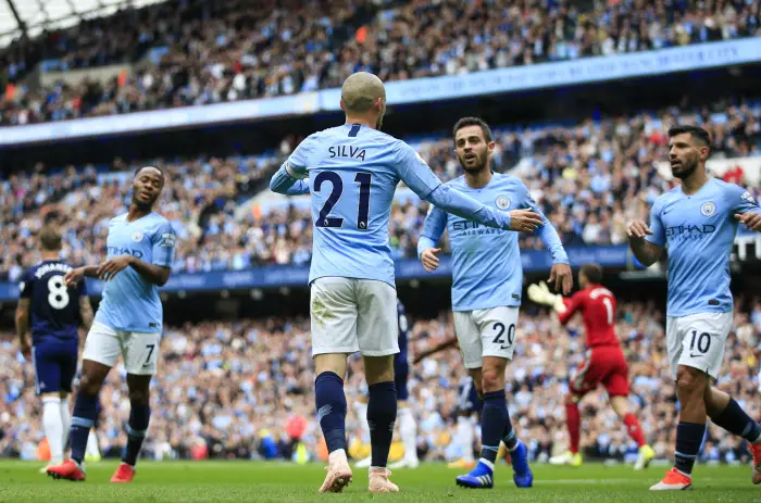 15th September 2018, Etihad Stadium, Manchester, England; EPL Premier League football, Manchester City versus Fulham; David Silva of Manchester City is congratulated by his team mates after scoring in the 21st minute to make it 2-0 to City