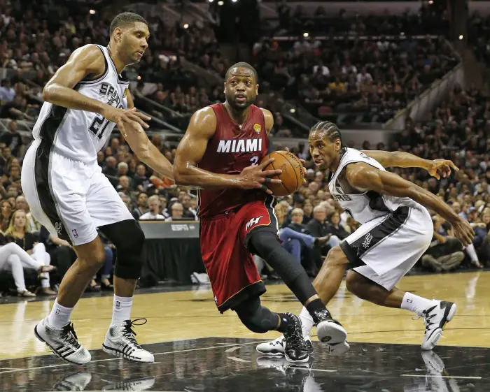 June 5, 2014 - San Antonio, TX, USA - The Miami Heat's Dwayne Wade drives against the San Antonio Spurs' Tim Duncan