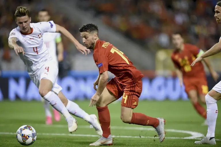 Belgium's forward Dries Mertens (C) fights for the ball during the UEFA Nations League football match between Belgium and Switzerland, at the King Baudouin Stadium, in Brussels, on October 12, 2018. (Photo by JOHN THYS / AFP)