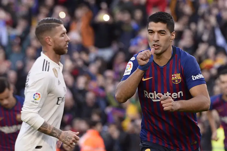 Barcelona's Uruguayan forward Luis Suarez celebrates scoring his team's second goal during the Spanish league football match between FC Barcelona and Real Madrid CF at the Camp Nou stadium in Barcelona on October 28, 2018. (Photo by Josep LAGO / AFP)
