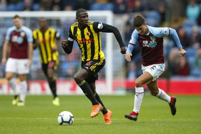 Abdoulaye Doucoure of Watford and Matthew Lowton of Burnley during the Premier League match between Burnley and Watford at Turf Moor on August 19th 2018 in Burnley, England.