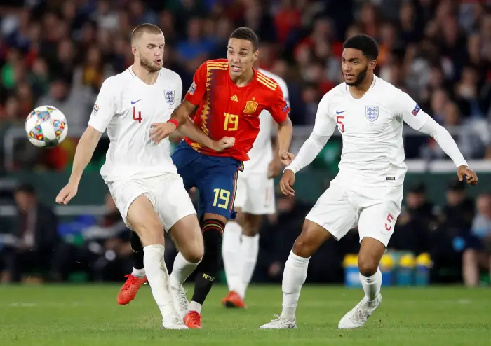 Soccer Football - UEFA Nations League - League A - Group 4 - Spain v England - Estadio Benito Villamarin, Seville, Spain - October 15, 2018  Spain's Rodrigo in action with England's Eric Dier and Joe Gomez