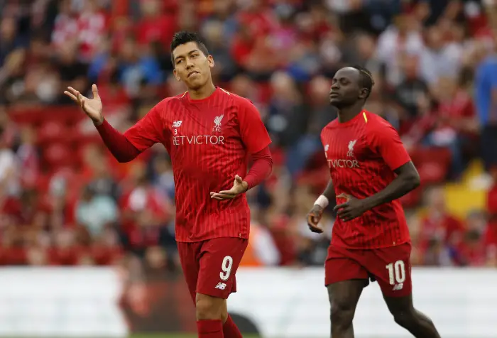7th August 2018, Anfield, Liverpool, England; Pre Season football friendly, Liverpool versus Torino; Roberto Firmino of Liverpool  warms up before the game with Sadio Mane in the background